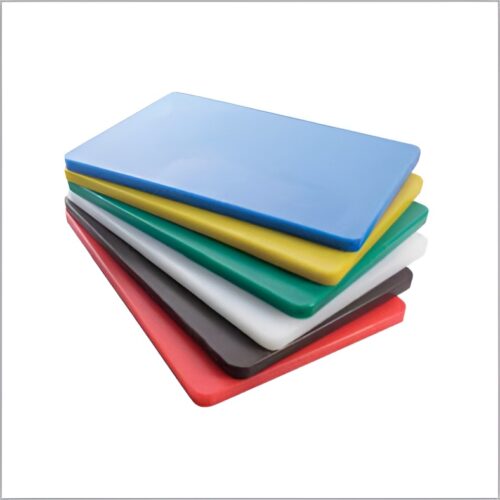 A stack of color-coded plastic chopping boards in various colors, including blue, yellow, green, white, brown, and red