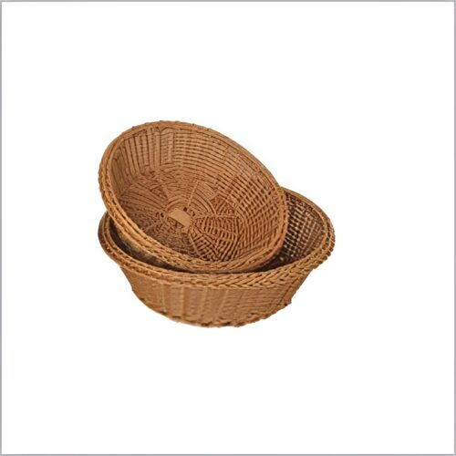 Oval woven bread baskets in two sizes, stacked inside each other.